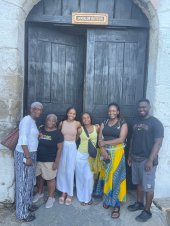 People visiting the historic Door of Return in Ghana with Timeh Tours.