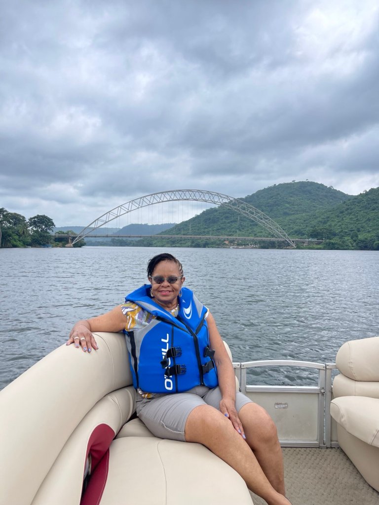 Tourist enjoying a boat cruise on the Volta River, one of the scenic places in Ghana