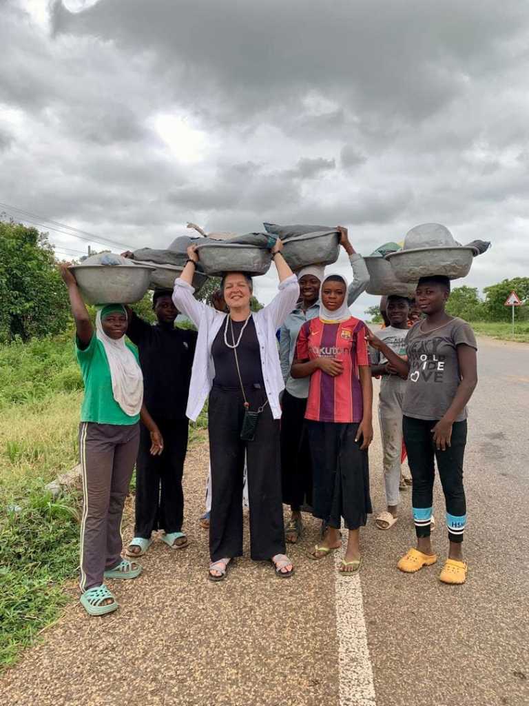Tourist experiencing daily life in a local village in Northern Ghana during a cultural tour with Timeh Tours